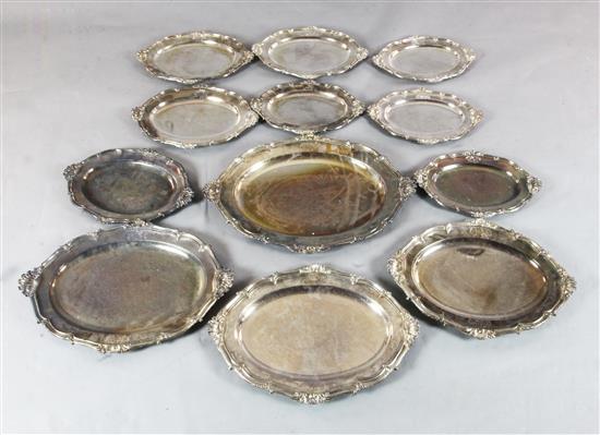 A set of twelve 19th century Sheffield plate shaped oval meat dishes, engraved with the Heneage family crest,